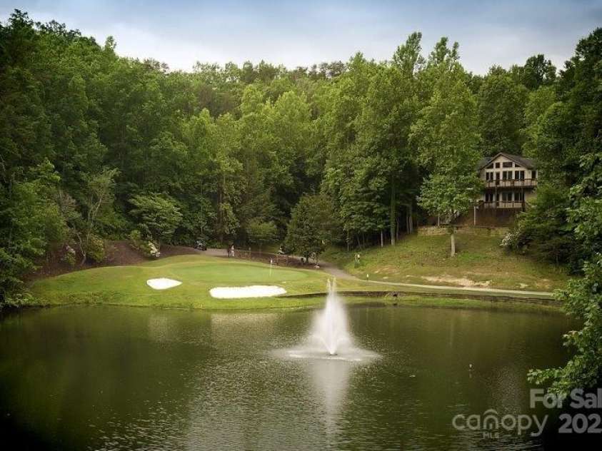 147 Lake Drive, Lake Lure, NC 28746.  MLS# CAR4221917, YatesRealty ID 16111. 