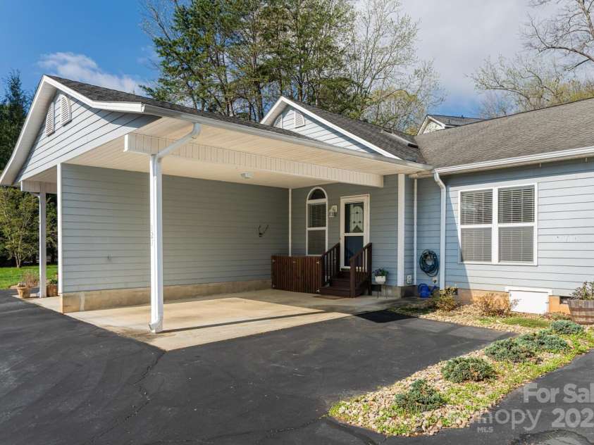 121 Shadowbrook Drive, Asheville, NC 28805.  MLS# CAR4243178, YatesRealty ID 16112. Carport plus 1 parking at entry