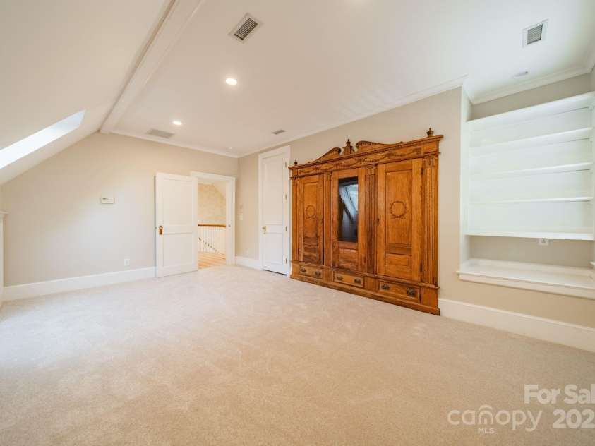 1333 Carlton Avenue, Charlotte, NC 28203.  MLS# CAR4211721, YatesRealty ID 16118. Secondary Bedroom #3 w/Built-in Antique Armoire from Baltimore Row Home