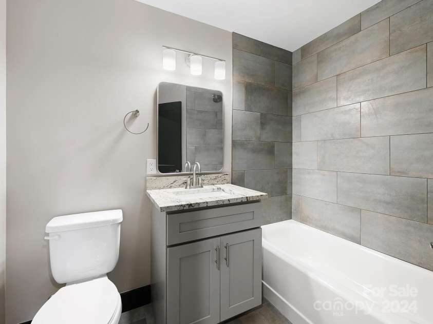 52 Fox Drive, Asheville, NC 28803.  MLS# CAR4201409, YatesRealty ID 16120. 3rd Full Bath in Lower Level