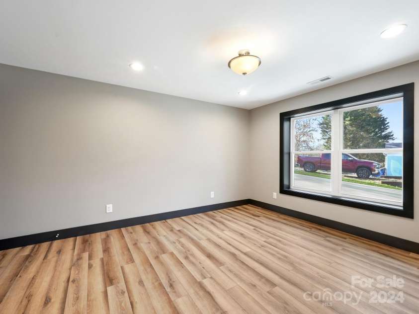 52 Fox Drive, Asheville, NC 28803.  MLS# CAR4201409, YatesRealty ID 16120. 4th Bedroom in Lower Level