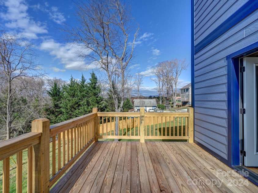 52 Fox Drive, Asheville, NC 28803.  MLS# CAR4201409, YatesRealty ID 16120. Long range mountain view from side deck