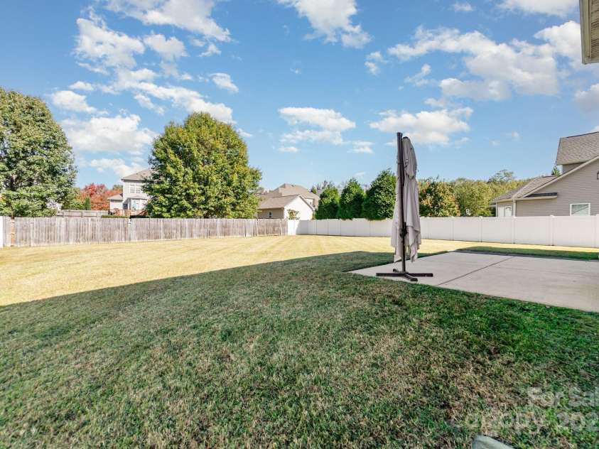 2677 Kinsley Avenue, Concord, NC 28027.  MLS# CAR4312032, YatesRealty ID 16121. Flat backyard 
