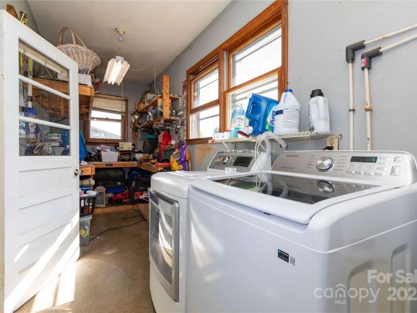 158 Morning Drive, Waynesville, NC 28786.  MLS# CAR4307923, YatesRealty ID 16122. Laundry in carport