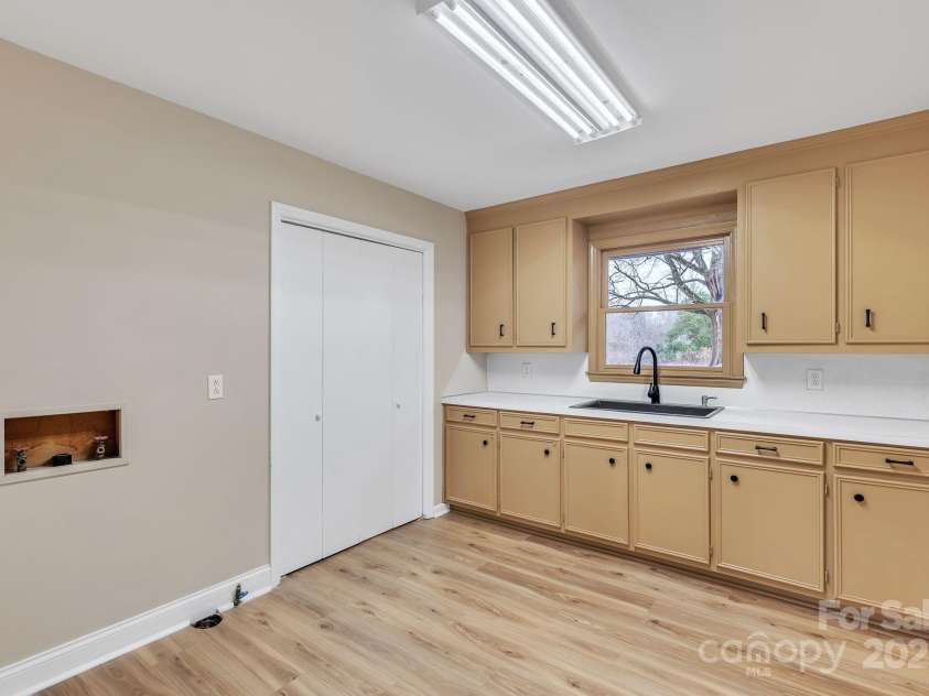 407 Thomas Street, Marshville, NC 28103.  MLS# CAR4216955, YatesRealty ID 16127. Large laudry room with extra storage and utility sink.