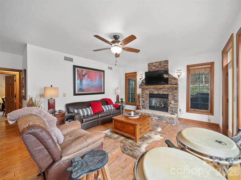 81 Creekside Way, Burnsville, NC 28714.  MLS# CAR4374251, YatesRealty ID 16129. Rock Fireplace with Propane Gas Logs