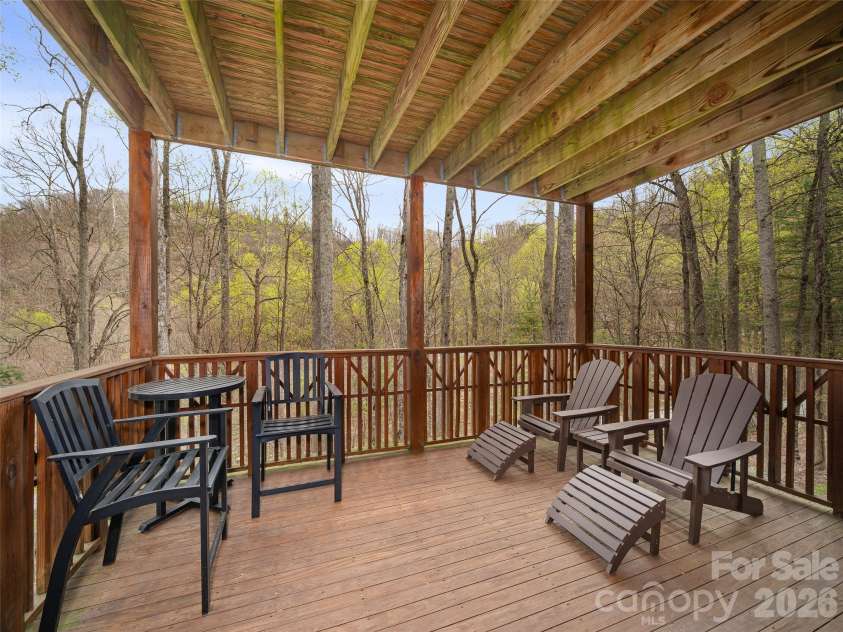 81 Creekside Way, Burnsville, NC 28714.  MLS# CAR4374251, YatesRealty ID 16129. Spacious covered Porch