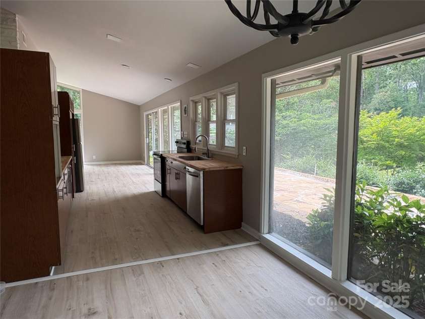 223 Forest Drive, Greenwood, SC 29646.  MLS# CAR4264303, YatesRealty ID 16134. Dining area with chandelier is adjacent to kitchen. Great views from all rooms!