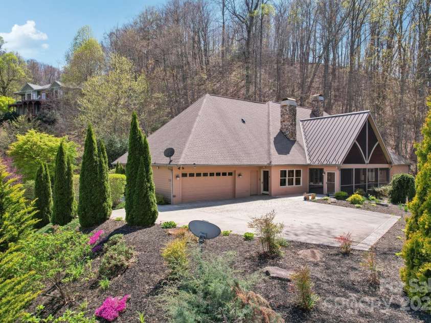 206 View Ridge Parkway, Leicester, NC 28748.  MLS# CAR4228261, YatesRealty ID 16135. Pristine landscaping beautifully frames the property