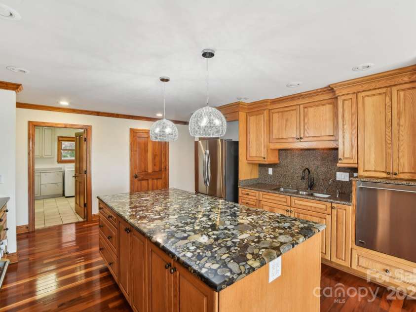 206 View Ridge Parkway, Leicester, NC 28748.  MLS# CAR4228261, YatesRealty ID 16135. The stunning kitchen island is both versatile and a perfect conversation piece, blending style with functionality