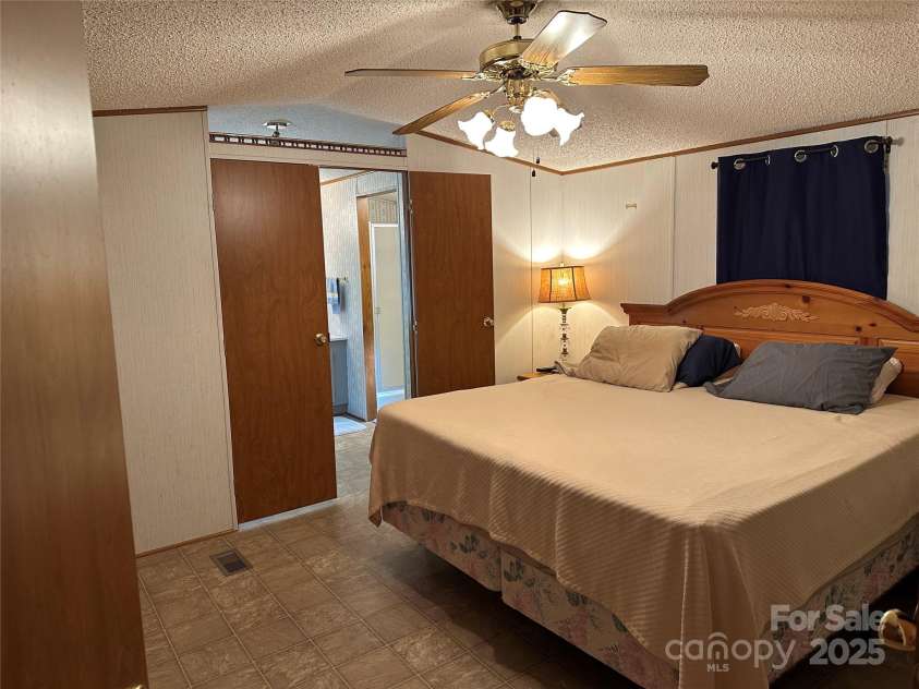 104 Ridge View Road, Penrose, NC 28766.  MLS# CAR4263668, YatesRealty ID 16150. Primary bedroom