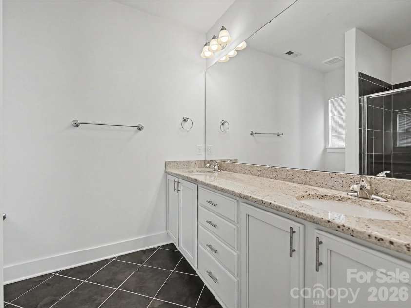 347 Spring Street, Davidson, NC 28036.  MLS# CAR4362683, YatesRealty ID 16152. En-suite Primary Bathroom with dual sinks