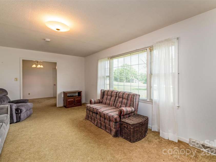 765 York Institute Road, Hiddenite, NC 28636.  MLS# CAR4260914, YatesRealty ID 16153. Looking into the dining room. Lots of light.