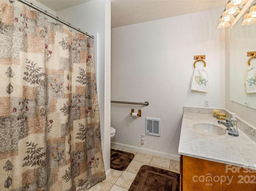 765 York Institute Road, Hiddenite, NC 28636.  MLS# CAR4260914, YatesRealty ID 16153. Main bathroom with walk-in shower