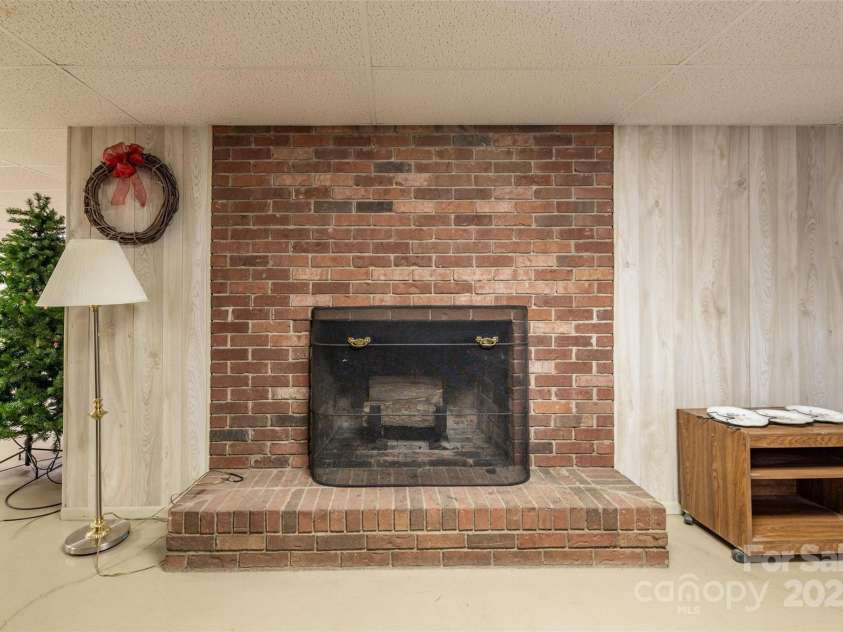 765 York Institute Road, Hiddenite, NC 28636.  MLS# CAR4260914, YatesRealty ID 16153. Wood burning fireplace in the basement