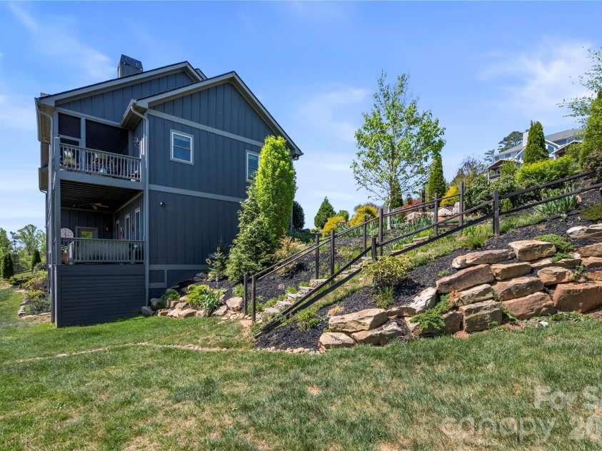 28 Gracie Lane, Weaverville, NC 28787.  MLS# CAR4361054, YatesRealty ID 16155. Thoughtfully designed yard with terraced stonework.