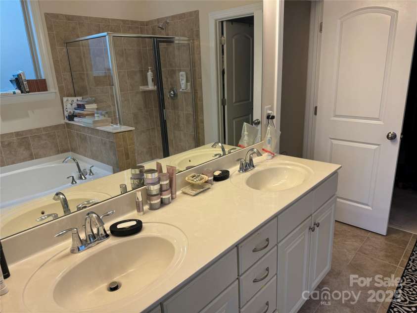 129 Johnson Manor Street, Mooresville, NC 28115.  MLS# CAR4197024, YatesRealty ID 16157. Double sinks in first floor suite bathroom