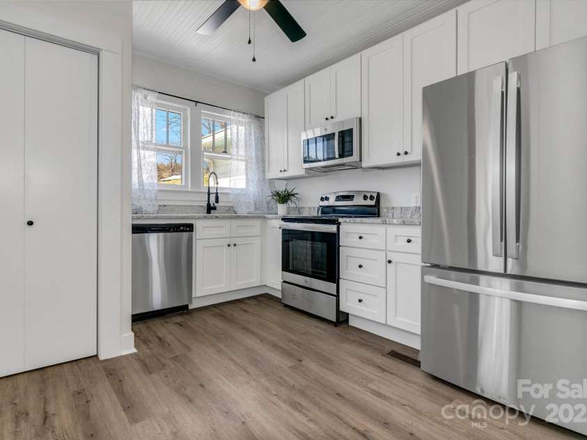 122 Old Nc 63 Highway, Leicester, NC 28748.  MLS# CAR4249489, YatesRealty ID 16160. Kitchen and :Laundry closet