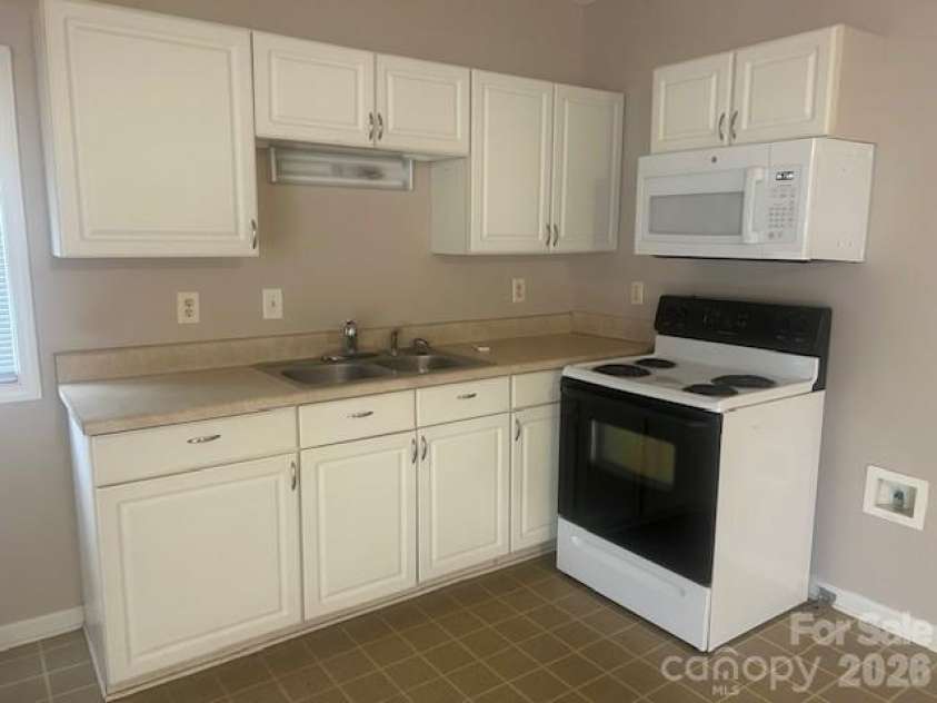 621 Elm Street, Marshville, NC 28103.  MLS# CAR4337317, YatesRealty ID 16163. Open kitchen/dining/kitchen