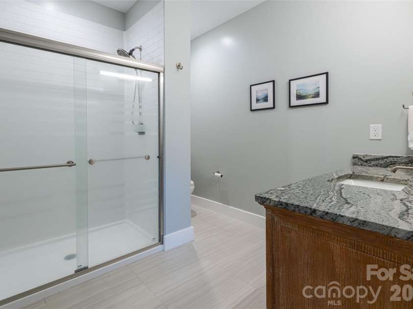 12 Horizon View Lane, Alexander, NC 28701.  MLS# CAR4373999, YatesRealty ID 16165. Lower Level guest bath