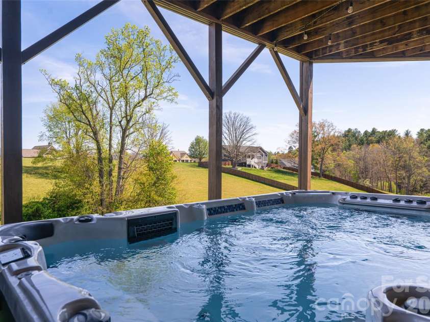 12 Horizon View Lane, Alexander, NC 28701.  MLS# CAR4373999, YatesRealty ID 16165. Swim spa with spectacular views!