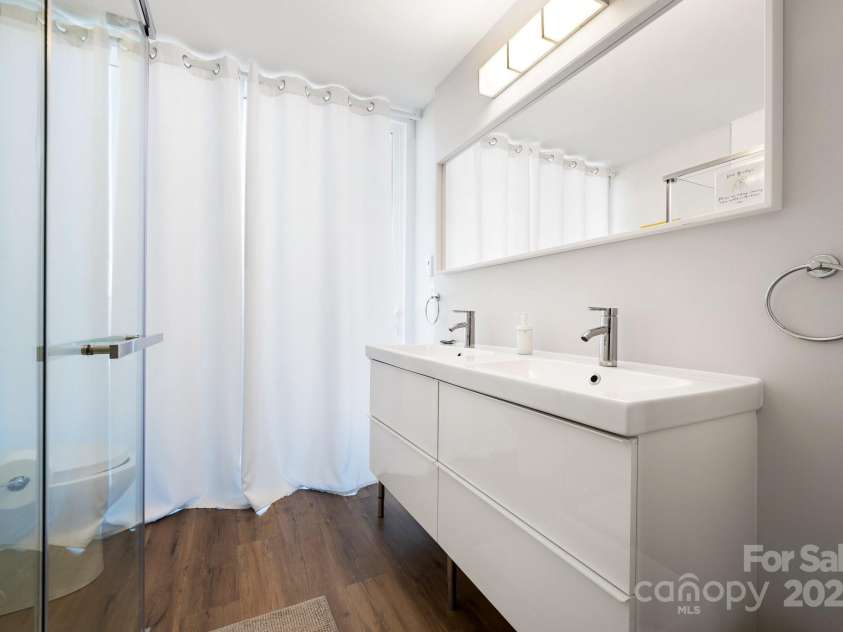 117 Commerce Street, Old Fort, NC 28762.  MLS# CAR4257223, YatesRealty ID 16167. Pre-Helene: Double Vanity in One of the Bathrooms