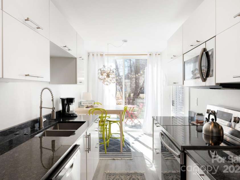 117 Commerce Street, Old Fort, NC 28762.  MLS# CAR4257223, YatesRealty ID 16167. Pre-Helene: Open Kitchen-Dining Room