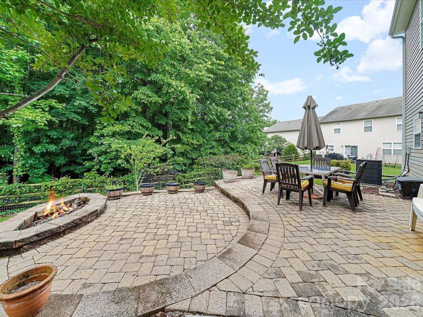2306 Nettleton Court, Matthews, NC 28105.  MLS# CAR4346998, YatesRealty ID 16167. Firepit