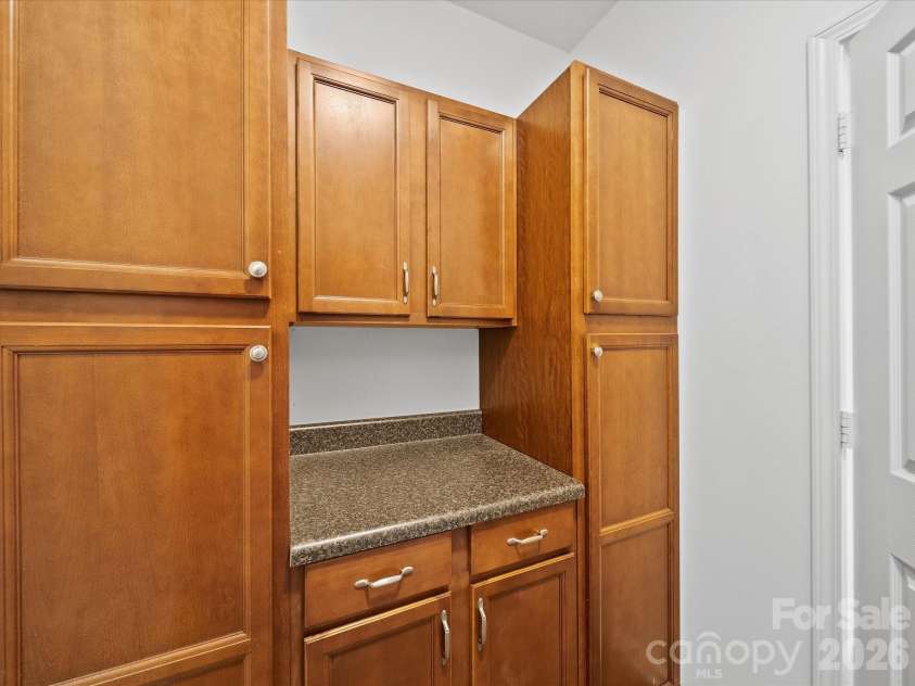 2306 Nettleton Court, Matthews, NC 28105.  MLS# CAR4346998, YatesRealty ID 16167. Laundry Room with Extra Storage