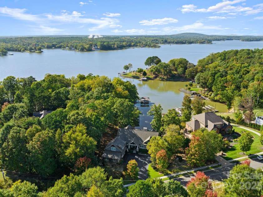 18420 Rosapenny Road, Charlotte, NC 28278.  MLS# CAR4240682, YatesRealty ID 16172. Aerial view of home and Lake Wylie