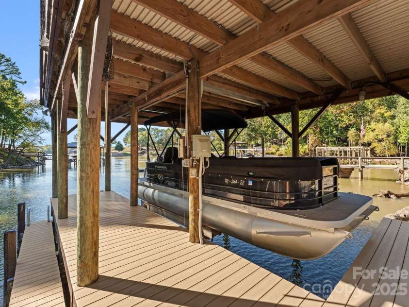 18420 Rosapenny Road, Charlotte, NC 28278.  MLS# CAR4240682, YatesRealty ID 16172. Boat lift with boat for sale