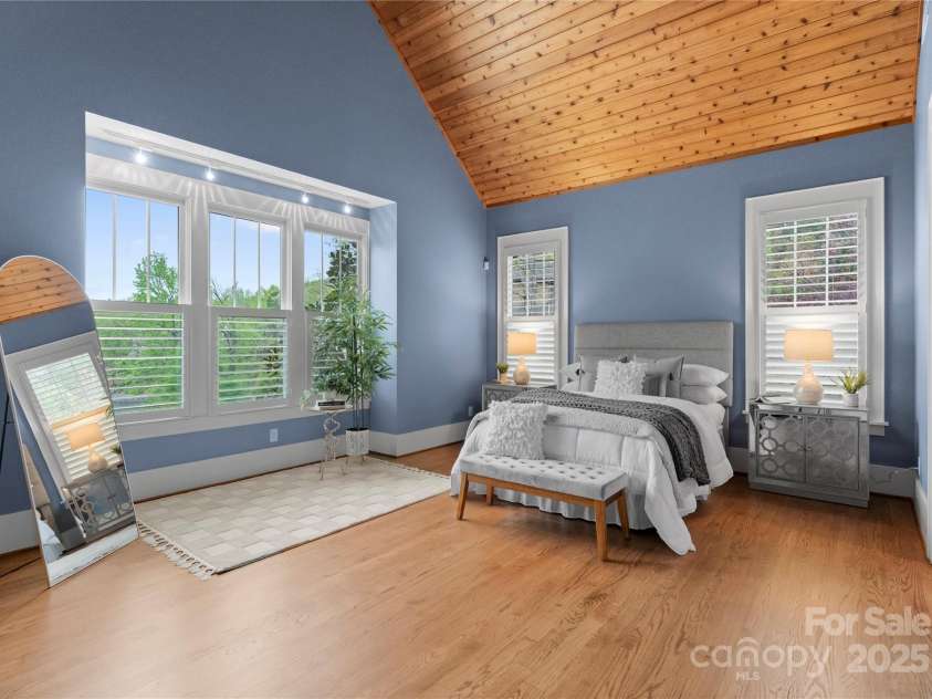 18420 Rosapenny Road, Charlotte, NC 28278.  MLS# CAR4240682, YatesRealty ID 16172. Vaulted Ceiling Primary Bedroom with views of the lake