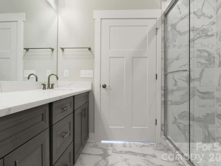 20 Brookstone Place, Candler, NC 28715.  MLS# CAR4368758, YatesRealty ID 16172. Primary Bathroom