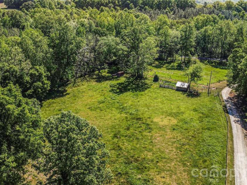 2040 Burke Road, Shelby, NC 28152.  MLS# CAR4367319, YatesRealty ID 16176. Long shared driveway with small shed and corral.  