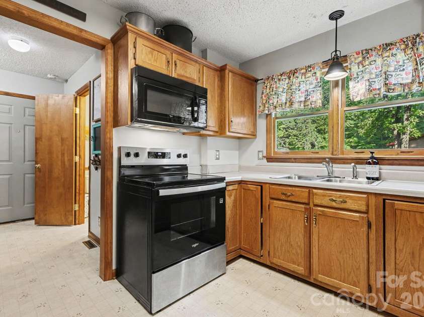 2040 Burke Road, Shelby, NC 28152.  MLS# CAR4367319, YatesRealty ID 16176. The kitchen has direct access to the garage entry with mudroom, pantry area,...