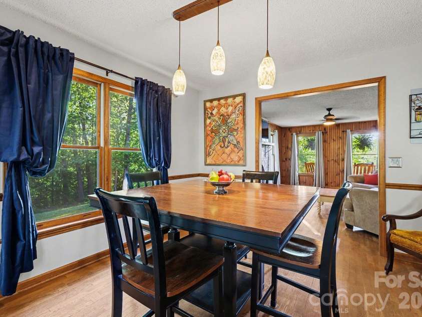 2040 Burke Road, Shelby, NC 28152.  MLS# CAR4367319, YatesRealty ID 16176. The living room flows into the dining area with plenty of space for gathering.