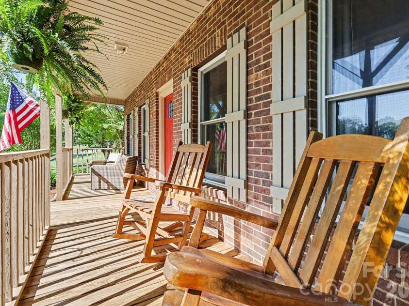 2040 Burke Road, Shelby, NC 28152.  MLS# CAR4367319, YatesRealty ID 16176. The porch is perfect for enjoying the peaceful evenings and long range farm view!