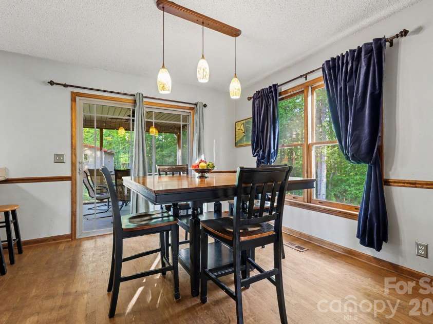 2040 Burke Road, Shelby, NC 28152.  MLS# CAR4367319, YatesRealty ID 16176. There is access to the screened porch off the dining area.