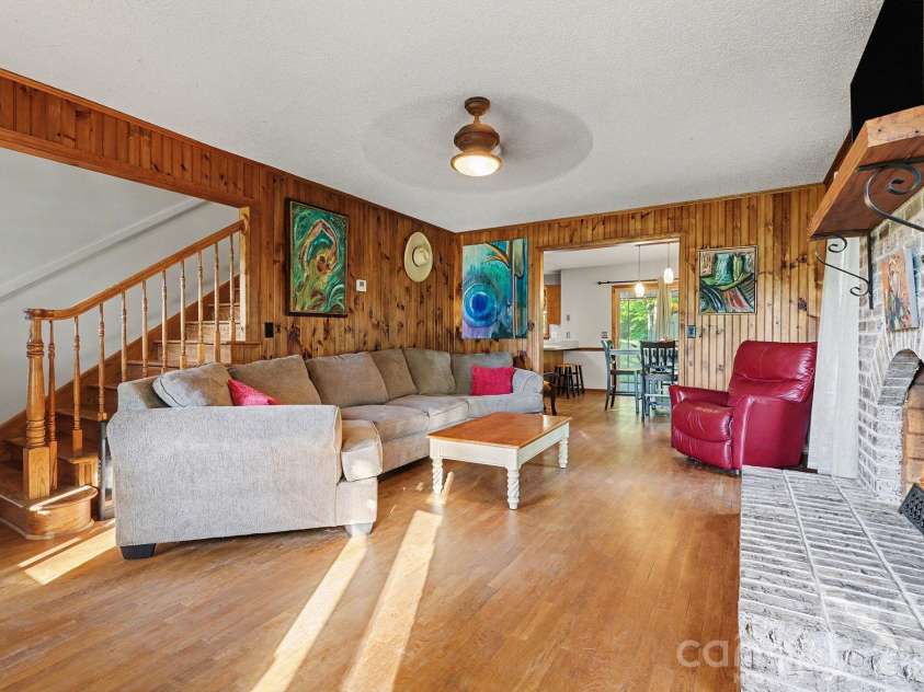 2040 Burke Road, Shelby, NC 28152.  MLS# CAR4367319, YatesRealty ID 16176. Upon entry, you are greeted by this inviting living room with warm wood paneling...