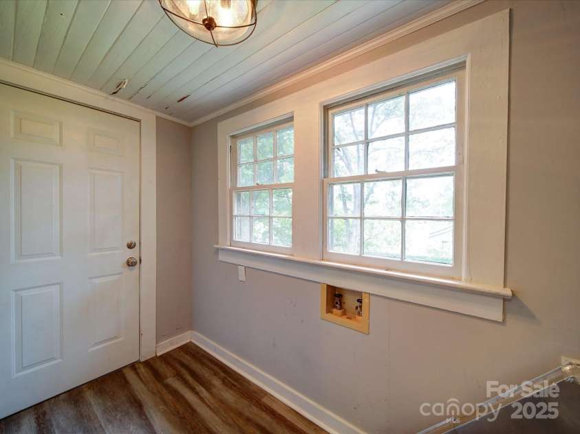 318 Chestnut Avenue, Kannapolis, NC 28081.  MLS# CAR4260562, YatesRealty ID 16180. Laundry room with updated flooring.