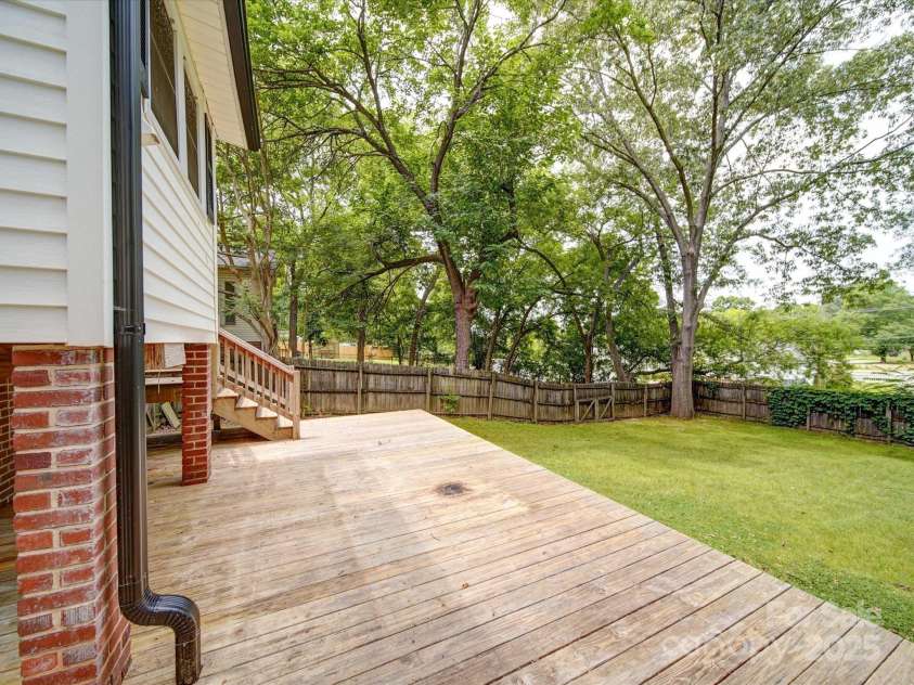 318 Chestnut Avenue, Kannapolis, NC 28081.  MLS# CAR4260562, YatesRealty ID 16180. Your newer deck overlooking a private fenced backyard.