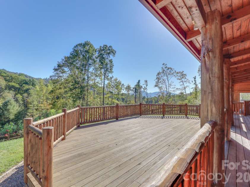 2811 Poplar Creek Road, Green Mountain, NC 28740.  MLS# CAR4370609, YatesRealty ID 16187. Front deck off covered porch