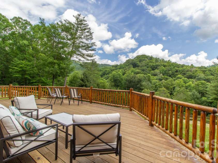 2811 Poplar Creek Road, Green Mountain, NC 28740.  MLS# CAR4370609, YatesRealty ID 16187. Short range views to the south from front deck