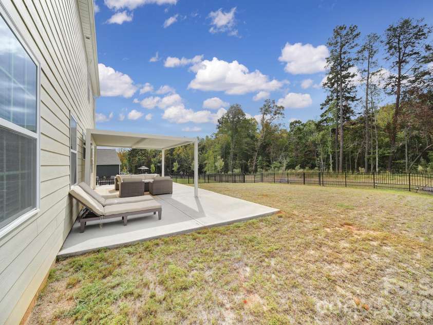 164 North Hill Lane, Troutman, NC 28166.  MLS# CAR4355544, YatesRealty ID 16189. Flat, Tree-lined Backyard with Fence