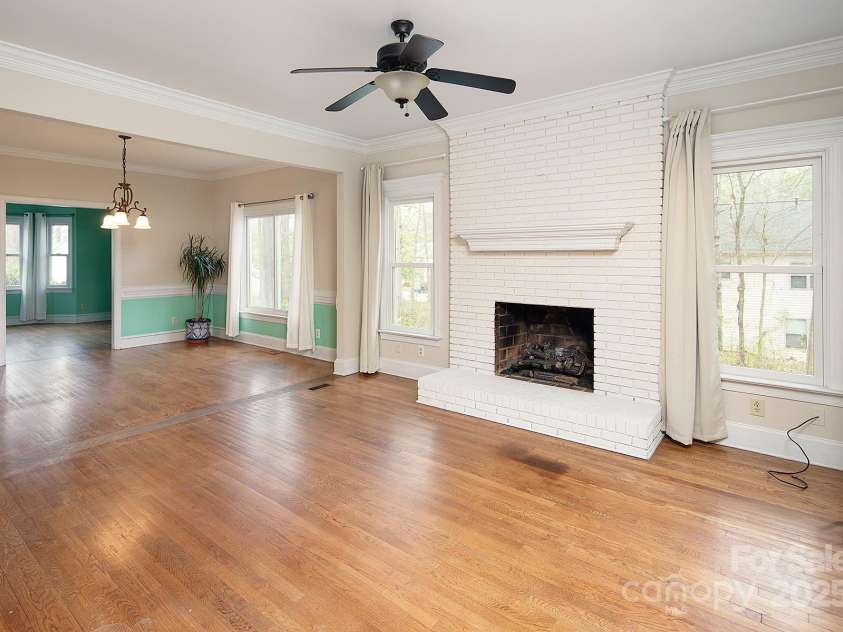 7007 Chapparall Lane, Charlotte, NC 28215.  MLS# CAR4223263, YatesRealty ID 16192. All brick painted fireplace