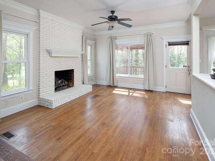 7007 Chapparall Lane, Charlotte, NC 28215.  MLS# CAR4223263, YatesRealty ID 16192. Family Room with fireplace