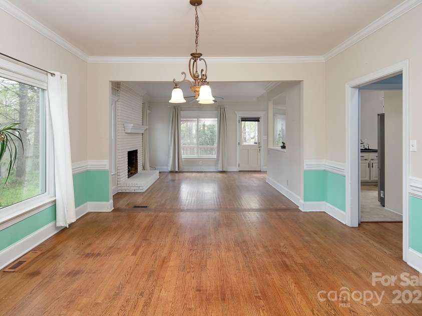 7007 Chapparall Lane, Charlotte, NC 28215.  MLS# CAR4223263, YatesRealty ID 16192. Flow from dining room into Family Room