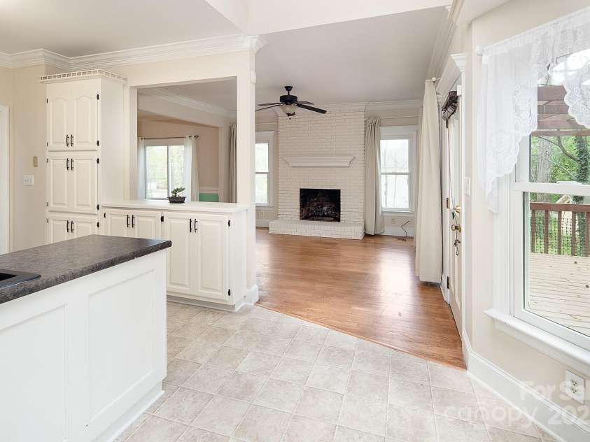 7007 Chapparall Lane, Charlotte, NC 28215.  MLS# CAR4223263, YatesRealty ID 16192. Flow from kitchen into family room
