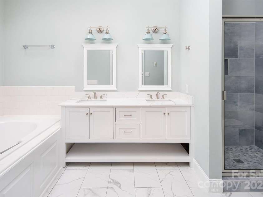 7007 Chapparall Lane, Charlotte, NC 28215.  MLS# CAR4223263, YatesRealty ID 16192. Fully Renovated Primary Bathroom with double vanity