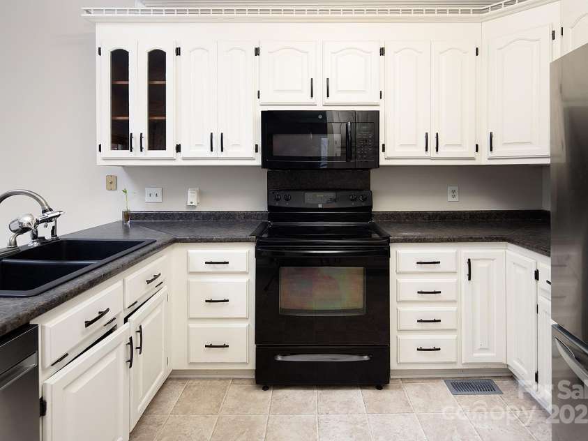 7007 Chapparall Lane, Charlotte, NC 28215.  MLS# CAR4223263, YatesRealty ID 16192. Kitchen with lots of storage